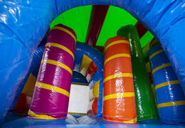 Multiplay unicorn bounce house with a slide, pillars on the jumping surface and striking 3D objects for children. Order inflatable bounce houses online at JB Inflatables UK