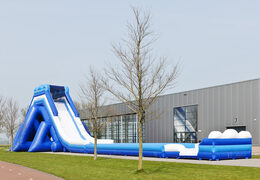 Monsterslide 11 meters high and 53 meters long with a double staircase and wide slide. Order inflatable slides now online at JB Inflatables UK