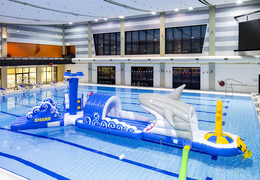 Order 13 meter long obstacle course shark run in a unique design with funny 3D objects and no less than 2 slides for both young and old. Buy inflatable pool obstacle courses online now at JB Inflatables America