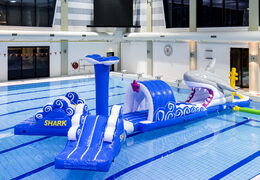 Inflatable 13 meter long shark run swimming pool obstacle course in a unique design with funny 3D objects and no less than 2 slides for both young and old. Order inflatable obstacle courses online now at JB Inflatables America