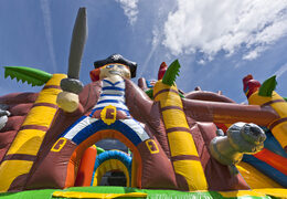 Buy mini inflatable pirate boat themed multiplay bouncy castle with slide for kids. Order inflatable bouncy castles online at JB Inflatables UK