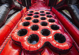 Buy a large 40 meter long inflatable red black mega alligator obstacle course. Order inflatable obstacle courses online now at JB Promotions UK
