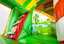 Buy Jungleworld bouncer in a unique design with two entrances, a slide in the middle and 3D objects for kids. Order bouncers online at JB Inflatables UK