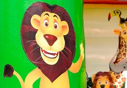 Buy a midi bounce house in a colour combination of green yellow and orange with a jungle theme for kids. Visit JB Inflatables UK online