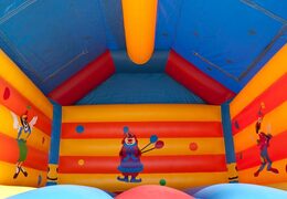 Big inflatable bounce house with roof in clown theme to buy for kids. Order online bounce houses at JB Inflatables UK