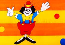 Clown in cheerful colors on inflatable