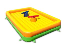 Gladiator play against each other on bouncy castle