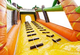 Climbing on a large obstacle course bouncy castle