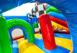 Green and blue arches and red pillars in multiplay bouncy castle Comic