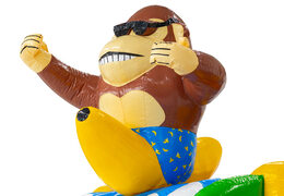 3D figure on bouncy castle Double-slide monkey with banana Beach theme.