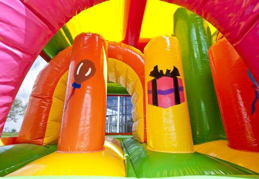 Medium inflatable princess themed bouncer with slide and pillars on the jumping surface, buy for children. Order inflatable bouncers online at JB Inflatables UK