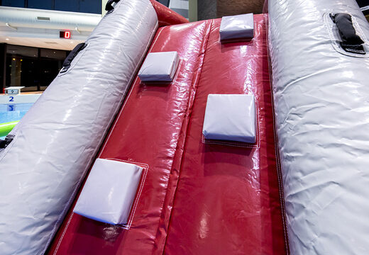 Cool shark themed play island with a vine, climbing tower, round slide and obstacles for both young and old. Order inflatable pool games now online at JB Inflatables America