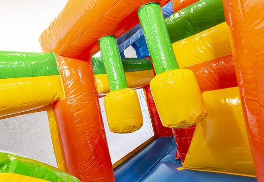 Multiplay party bouncer with a slide, fun objects on the jumping surface and eye-catching 3D objects for kids. Order inflatable bouncers online at JB Inflatables UK