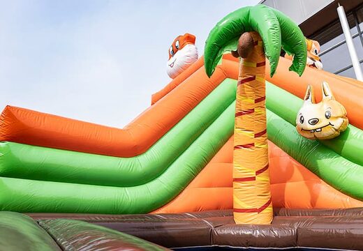 Order an inflatable jungle bouncer with slides and fun obstacles with prints for children. Buy bouncers online at JB Inflatables UK