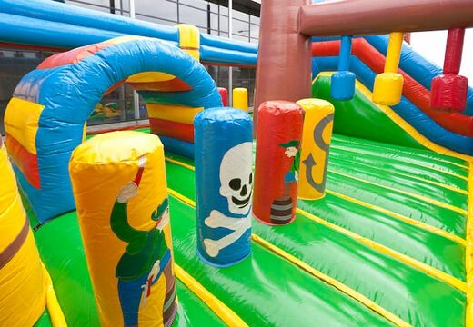 Order a pirate boat bouncy castle in a unique design with two entrances, a slide in the middle and 3D objects for kids. Buy bouncy castles online at JB Inflatables UK