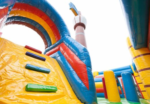 Large inflatable indoor pirate boat multiplay bouncer with slide in Lego theme for kids. Buy bouncers online at JB Inflatables UK