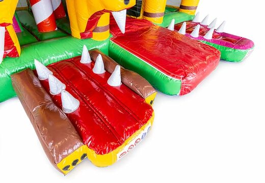 Indoor multiplay Jungleworld bouncy castle in a unique design with two entrances, a slide in the middle and 3D objects for kids. Buy bouncy castles online at JB Inflatables UK