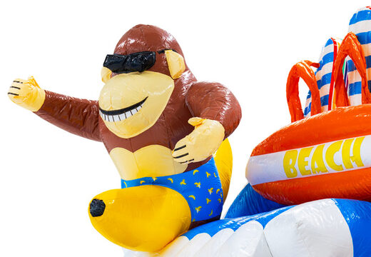 3D figure on the inflatable castle Double Slide monkey with banana theme beach