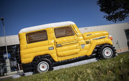 Personalized Toyota Land Cruiser Autobedrijf van der Linde bouncy castle made in your own corporate identity at JB Promotions UK. Order online promotional bouncy castles in all shapes and sizes